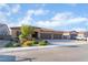 Charming single-story home with a three-car garage, desert landscaping, and inviting curb appeal at 5371 Brevin Ct, Las Vegas, NV 89131