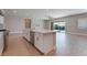 Bright kitchen with large island, stainless steel appliances, and tile flooring at 5371 Brevin Ct, Las Vegas, NV 89131