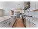 Bright, open-concept kitchen with a large island, stainless steel appliances, and white cabinetry at 5371 Brevin Ct, Las Vegas, NV 89131