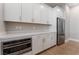 Bright kitchen features white cabinetry, stainless steel appliances, and marble countertops at 5371 Brevin Ct, Las Vegas, NV 89131