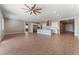 Spacious open-concept living room with tile flooring, modern lighting, and an airy atmosphere at 5371 Brevin Ct, Las Vegas, NV 89131