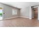 Open living room with tile flooring and access to outdoor living area at 5371 Brevin Ct, Las Vegas, NV 89131