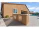 Outdoor kitchen with built-in storage, stainless steel access doors, and a convenient layout at 5371 Brevin Ct, Las Vegas, NV 89131