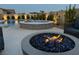 Cozy outdoor area with a fire pit, pool, and spa with stone accents at 5371 Brevin Ct, Las Vegas, NV 89131