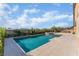 Beautiful backyard pool with stone patio, lush landscaping, and serene outdoor living space at 5371 Brevin Ct, Las Vegas, NV 89131