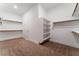 Walk-in closet with carpet flooring, shelves, and hanging rods at 5371 Brevin Ct, Las Vegas, NV 89131
