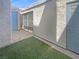 Enclosed backyard with artificial grass, creating a secure outdoor space with a door to the house at 5383 Mountain Vista St # 20, Las Vegas, NV 89120
