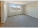 Bright bedroom with carpet flooring, a large window, and natural light, offering a calming space at 5383 Mountain Vista St # 20, Las Vegas, NV 89120