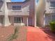 Charming two-story townhome featuring a well-maintained front yard and inviting entrance, perfect for comfortable living at 5383 Mountain Vista St # 20, Las Vegas, NV 89120