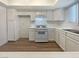 Modern kitchen with white cabinets, appliances, and light countertops offer style and functionality at 5383 Mountain Vista St # 20, Las Vegas, NV 89120
