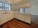 Well-lit kitchen with wood floors, updated appliances, and adjacent dining area at 5383 Mountain Vista St # 20, Las Vegas, NV 89120