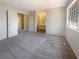 Spacious main bedroom with carpet flooring and ensuite bathroom, creating a private retreat at 5383 Mountain Vista St # 20, Las Vegas, NV 89120