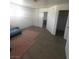 Bedroom featuring bare floor, white walls, and a closet at 5580 E Carey Ave, Las Vegas, NV 89156