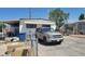 Exterior of home with carport and tan SUV parked out front at 5580 E Carey Ave, Las Vegas, NV 89156