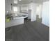Bright kitchen features white cabinets and a breakfast bar, open to the spacious living area at 5580 E Carey Ave, Las Vegas, NV 89156