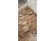 Yard featuring dirt, dead vegetation, and broken pieces of pavement next to a wall at 5580 E Carey Ave, Las Vegas, NV 89156