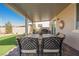 Covered patio featuring brick pavers, comfortable seating and mountain views, offering a great space for outdoor gatherings at 6225 Gambetta St, Las Vegas, NV 89115
