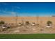 Well maintained backyard featuring rock landscaping with stepping stones and potted plants at 6225 Gambetta St, Las Vegas, NV 89115
