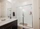 Modern bathroom features single sink, granite countertop, walk-in shower and neutral paint at 6225 Gambetta St, Las Vegas, NV 89115