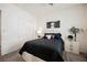 This bedroom features a black comforter, modern nightstand, and a closet at 6225 Gambetta St, Las Vegas, NV 89115