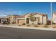 A lovely single-story house featuring a two-car garage, desert landscaping, and a durable tile roof at 6225 Gambetta St, Las Vegas, NV 89115
