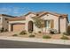 A well-kept single-story home with a two-car garage, desert landscaping, and a beautiful tile roof at 6225 Gambetta St, Las Vegas, NV 89115