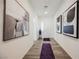 Hallway with modern decor, a decorative vase, and a purple area rug at 6225 Gambetta St, Las Vegas, NV 89115