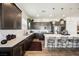 Modern kitchen features stainless steel appliances, white countertops, and dark cabinets at 6225 Gambetta St, Las Vegas, NV 89115