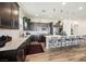 Modern kitchen with stainless steel appliances, pendant lighting and a large island with bar seating at 6225 Gambetta St, Las Vegas, NV 89115