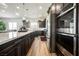 The kitchen features an oversized island with a white countertop and dark wood cabinetry at 6225 Gambetta St, Las Vegas, NV 89115