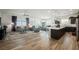 Bright, open-concept living room features wood-style tile flooring, stylish furnishings and lots of natural light at 6225 Gambetta St, Las Vegas, NV 89115