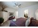 Comfortable bedroom features ceiling fan, neutral walls and ensuite bathroom access at 6225 Gambetta St, Las Vegas, NV 89115