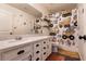 bathroom with playful truck theme and a white vanity with ample storage space at 6308 Gulf Waters St, North Las Vegas, NV 89081
