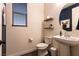 Half bathroom features decor, floating shelves and a modern vanity at 6308 Gulf Waters St, North Las Vegas, NV 89081