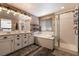 Bathroom features a double sink vanity, separate shower and tub at 6308 Gulf Waters St, North Las Vegas, NV 89081