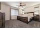 Spacious bedroom features a king bed, ceiling fan and neutral tones at 6308 Gulf Waters St, North Las Vegas, NV 89081