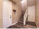 Inviting entryway with wood-look floors and a staircase leading to the upper level at 6308 Gulf Waters St, North Las Vegas, NV 89081