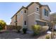 Attractive exterior elevation of a two-story home with a two-car garage and desert landscaping at 6308 Gulf Waters St, North Las Vegas, NV 89081