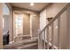 Hallway featuring wood-look flooring, a staircase, and neutral wall paint at 6308 Gulf Waters St, North Las Vegas, NV 89081