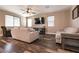 Comfortable living room with wood-look floors, neutral walls, and ample natural light at 6308 Gulf Waters St, North Las Vegas, NV 89081