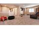 Carpeted upstairs loft with a television and seating at 6308 Gulf Waters St, North Las Vegas, NV 89081