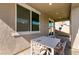 Covered patio featuring a dining table, providing a comfortable outdoor space at 6308 Gulf Waters St, North Las Vegas, NV 89081