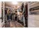 Spacious walk-in closet with custom shelving and hanging racks for organized storage at 6308 Gulf Waters St, North Las Vegas, NV 89081