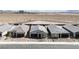 Overhead view of several single-story homes with gray roofs and desert landscaping at 6726 N Palmer Estates St, North Las Vegas, NV 89086