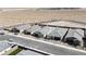 Aerial shot of single-story homes with desert landscape, street access, and a nearby pool at 6726 N Palmer Estates St, North Las Vegas, NV 89086