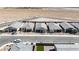 Stunning aerial view of several single-story homes with desert landscaping and a pool at 6726 N Palmer Estates St, North Las Vegas, NV 89086