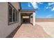 Covered back patio with brick flooring and a beautiful backyard view at 6726 N Palmer Estates St, North Las Vegas, NV 89086