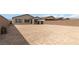 Spacious backyard with a patio and block wall, perfect for outdoor activities at 6726 N Palmer Estates St, North Las Vegas, NV 89086