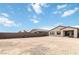 View of the home's backyard with patio and block wall at 6726 N Palmer Estates St, North Las Vegas, NV 89086