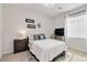 Comfortable bedroom featuring a bed, side tables, and a television at 6726 N Palmer Estates St, North Las Vegas, NV 89086